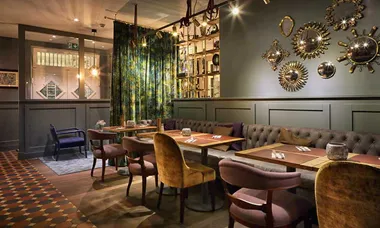 Restaurant-tables-at-Spedition-Hotel,-Thun,-Switzerland,-hotel-design-by-Stylt-Trampoli
