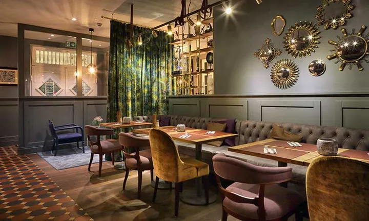 Restaurant-tables-at-Spedition-Hotel,-Thun,-Switzerland,-hotel-design-by-Stylt-Trampoli