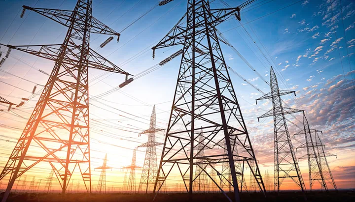 High-voltage power lines at sunset. electricity distribution station.
